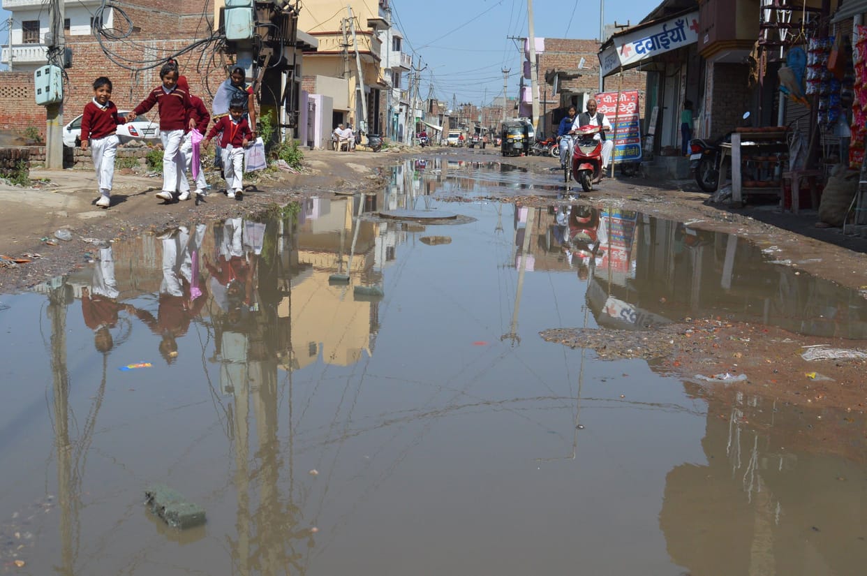 water logging, people protest, road