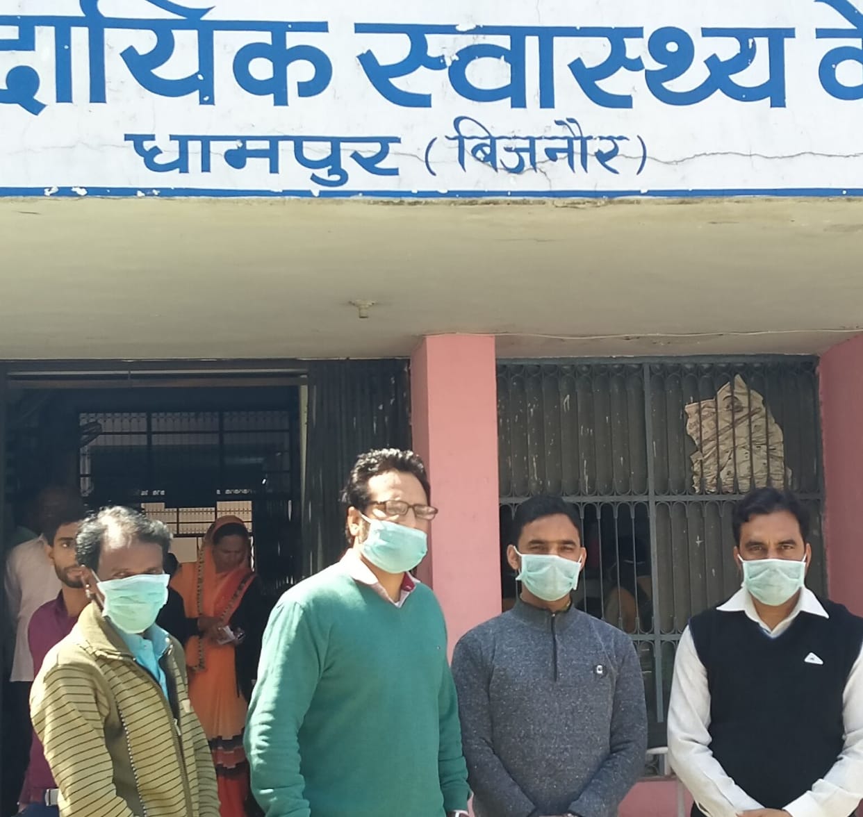 Physicians and employees treating patients with masks