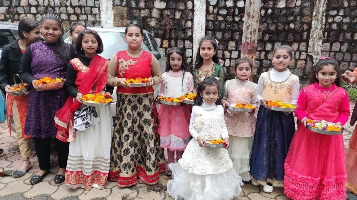 Girls made flower rangoli outside CM residence