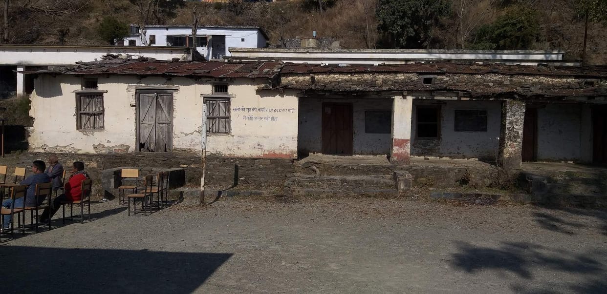 Students studying in shabby school building