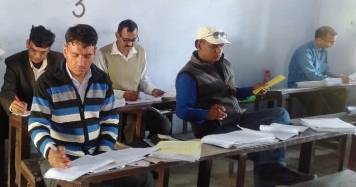 390 examiners screened 14239 answerbooks