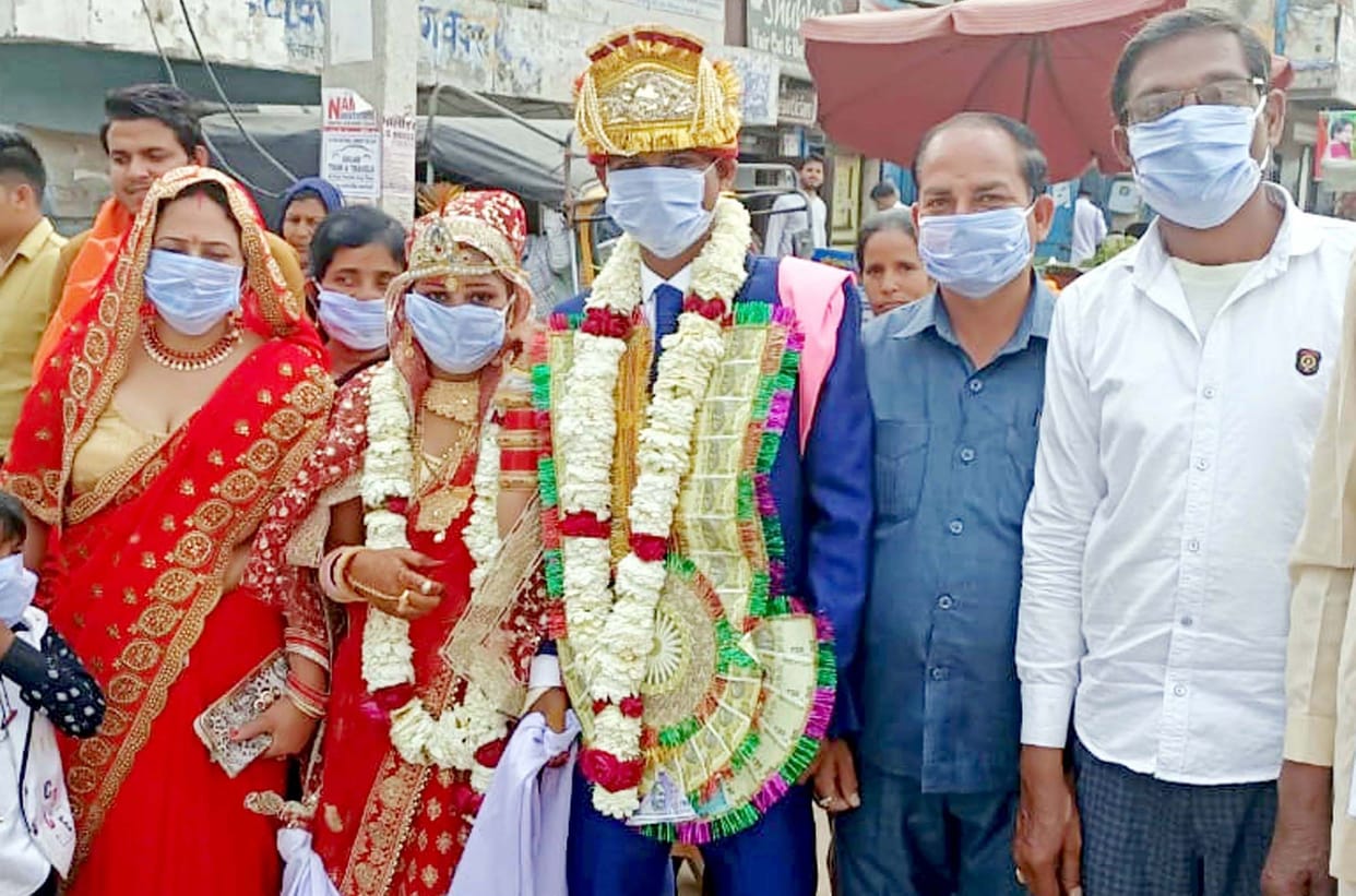 bride and groom gets mask