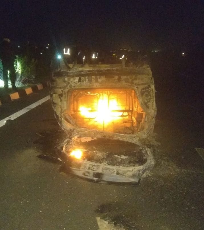 Fire in the overturned car after hitting the divider