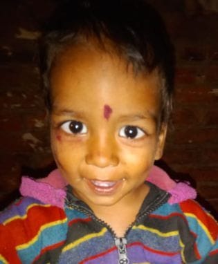 A child playing at the door crushed to death by a tractor