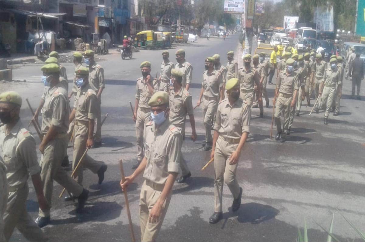 Coronavirus in india: Meerut police sanitizing their sticks for people of rules breaker of the lockdown