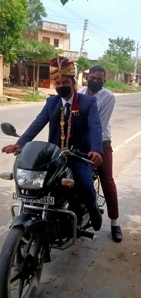 The groom came by bike to pick up the bride