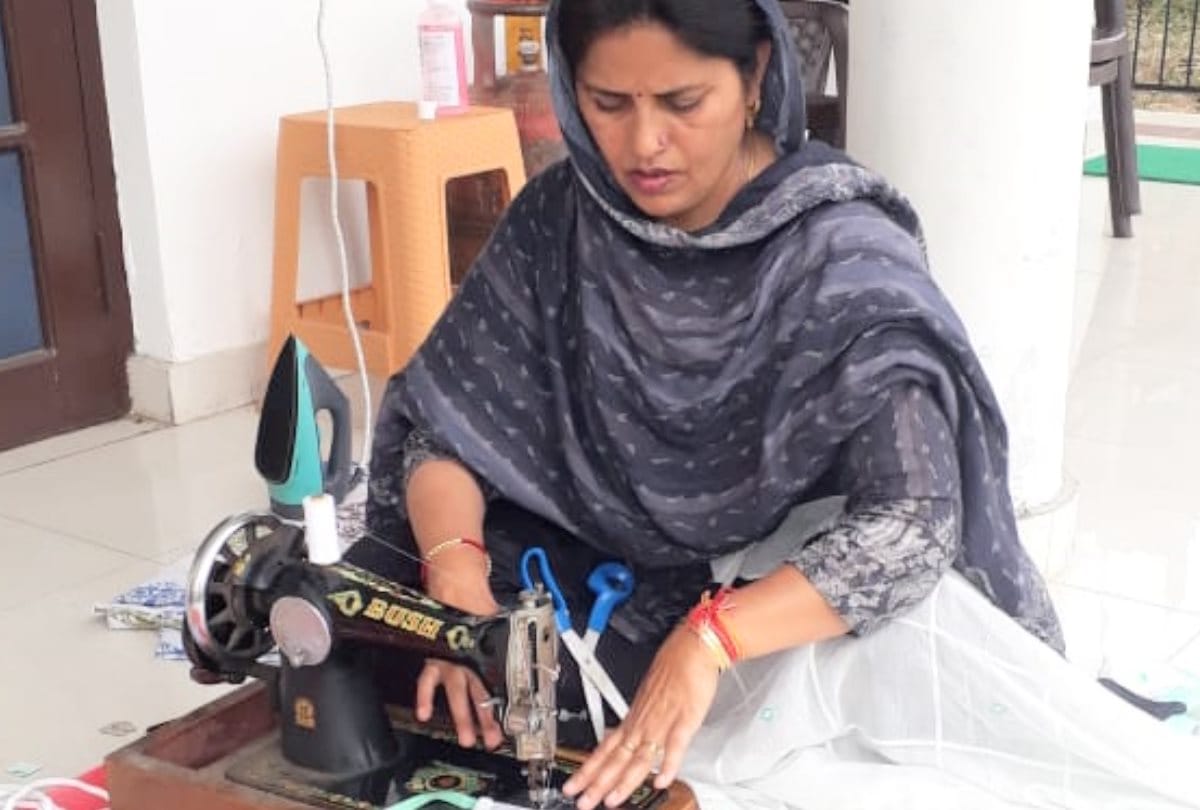 BJP MLA Kamlesh Kumari making masks with sewing machine at home in Bhoranj in Hamirpur in Himachal Pradesh