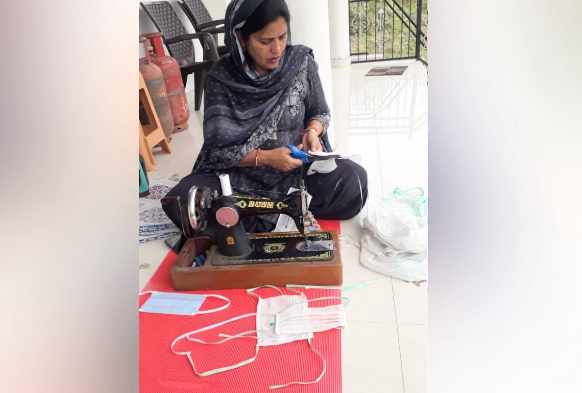 BJP MLA Kamlesh Kumari making masks with sewing machine at home in Bhoranj in Hamirpur in Himachal Pradesh