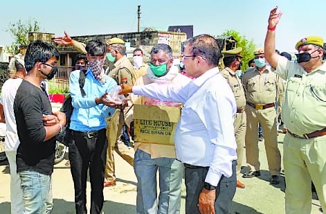 Officers including ADG distributed food to laborers, got fever