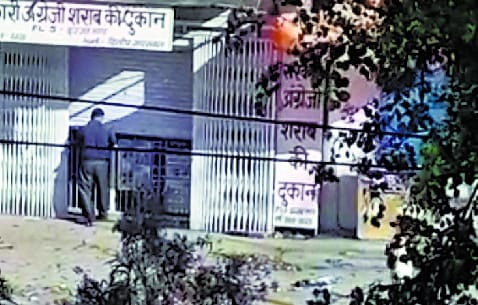 Not under cover, liquor being sold in black by open shop