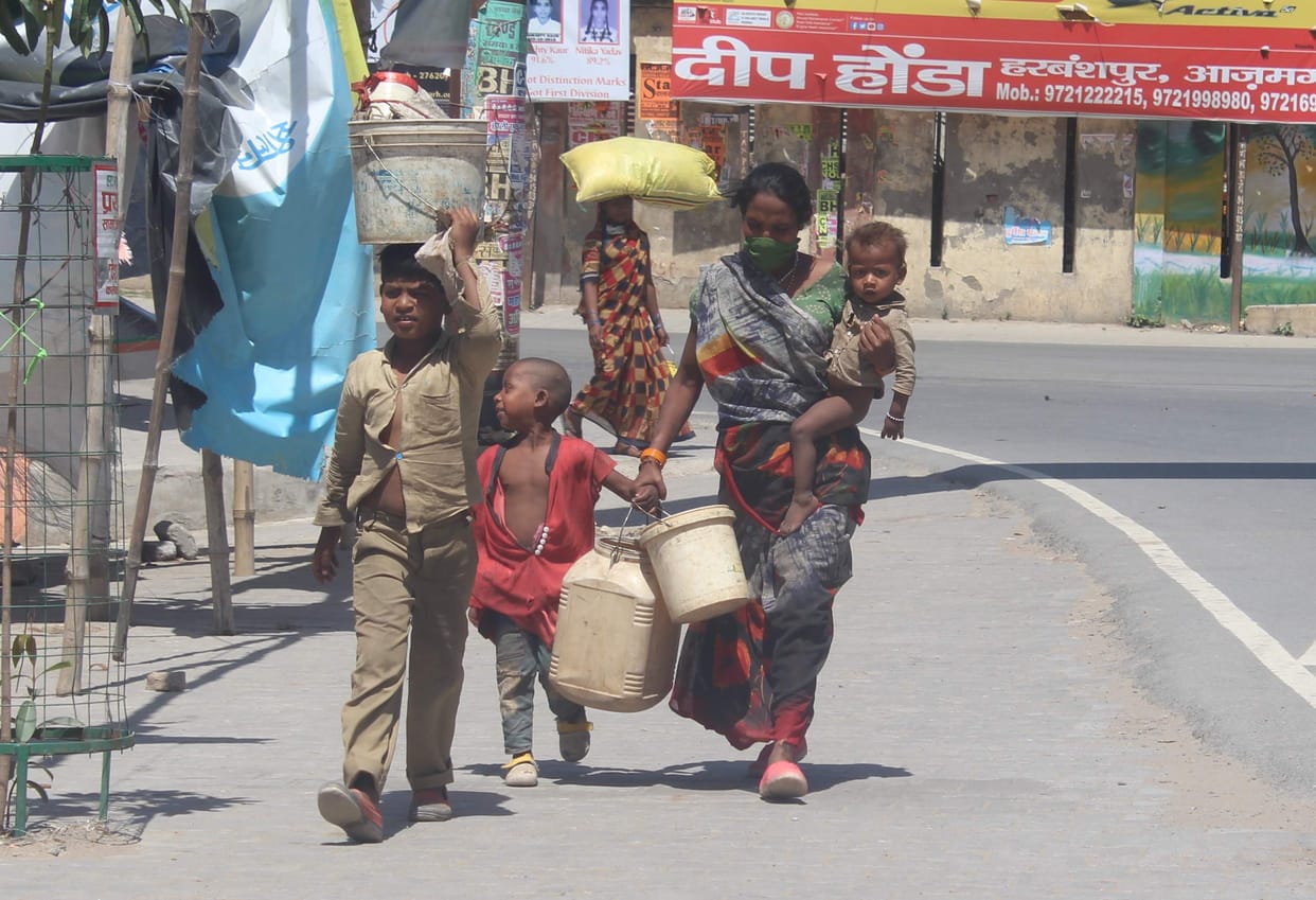 Baby in lap, bundle on head and hope to reach home