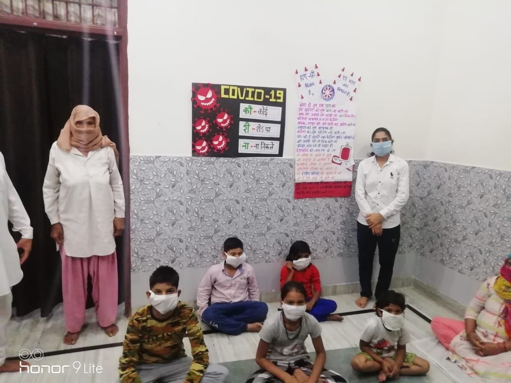 Girls are distributing Mask after making it by self