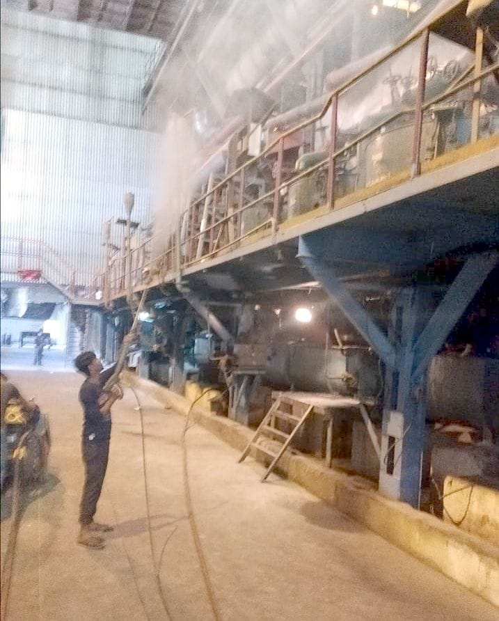 Spraying sanitizer in sugar mill