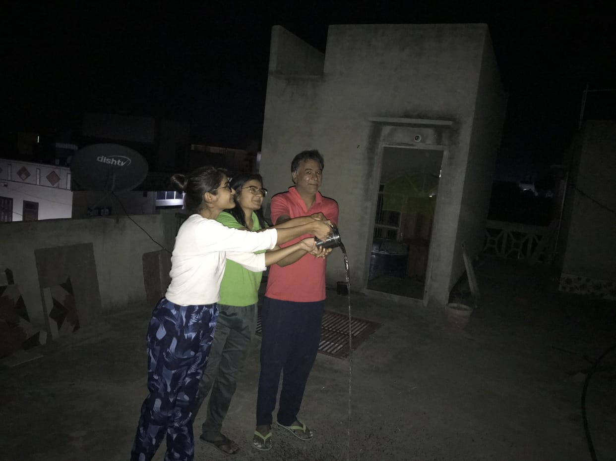 People involved in offering the inverted moon.