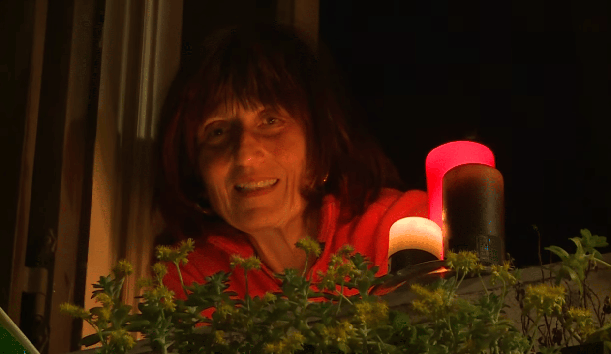 Corona virus Italians light candles at their windows and terrace to beat virus blues