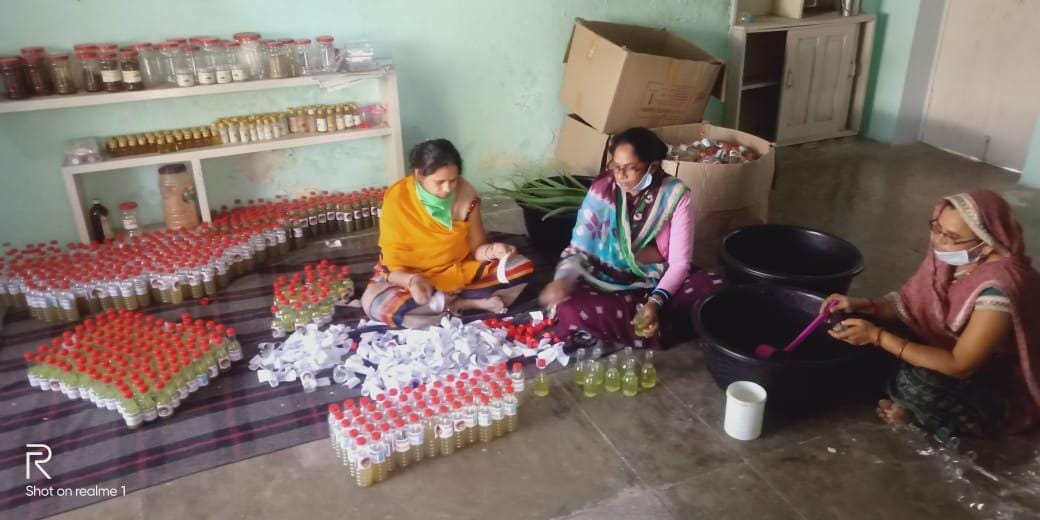 Women of the group are making sanitizer