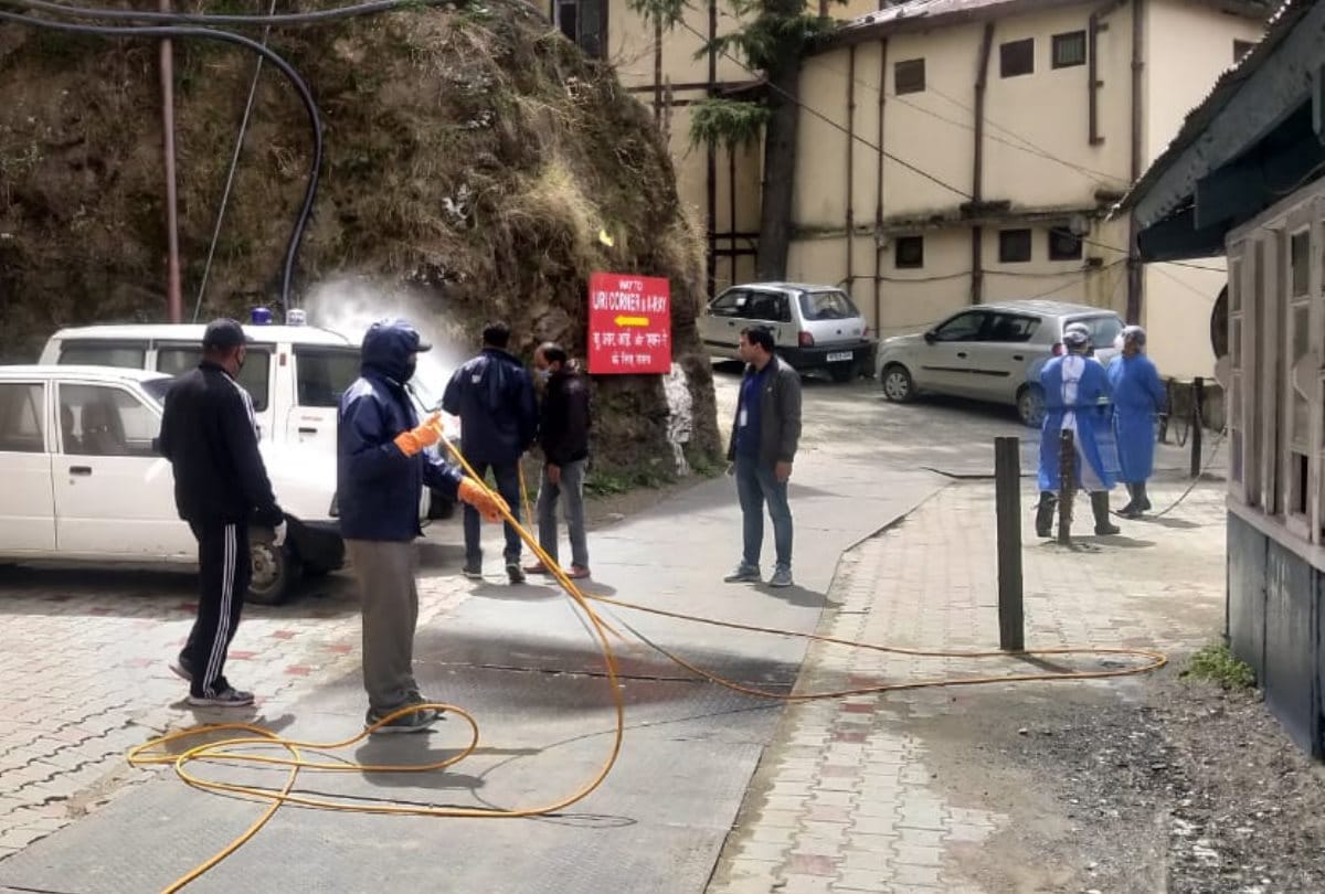 MC Shimla employees sanitize shoghi to IGMC Road after three positive corona cases