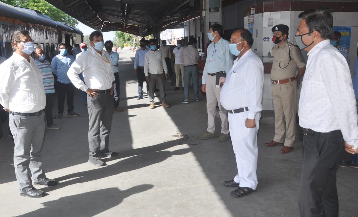 Railway officials and employees wear regular masks