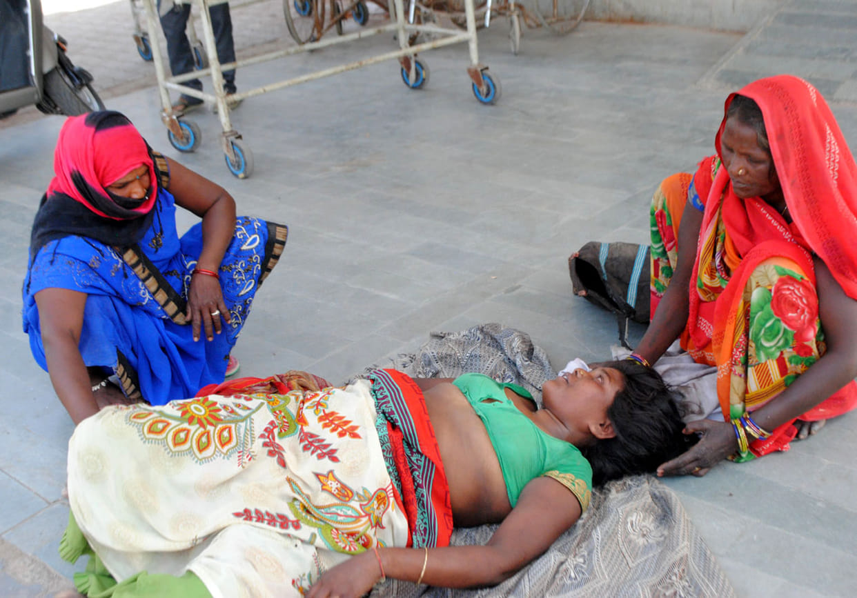 Chitrakoot: a woman lying on the ground waiting for treatment