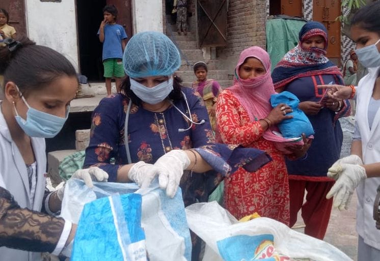 Distribution of ration kits and masks to 20 poor families