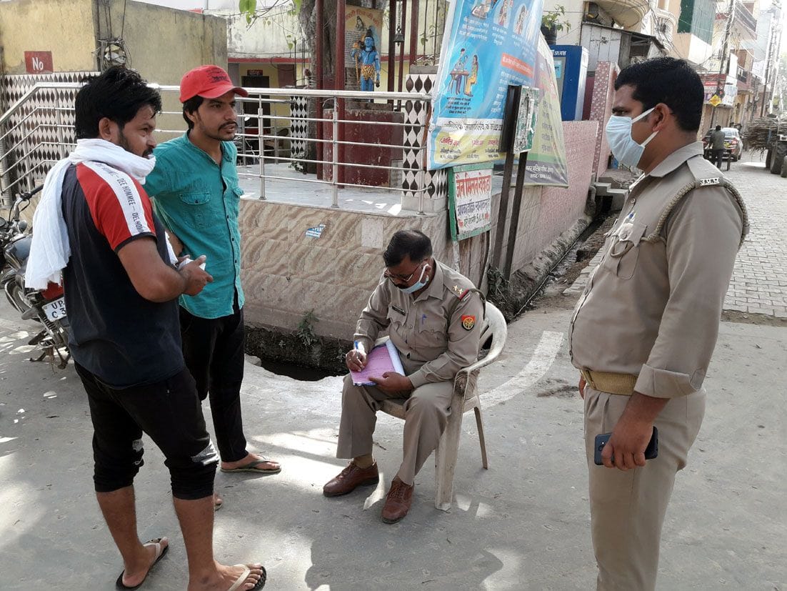 Distribute challans and masks of bike riders