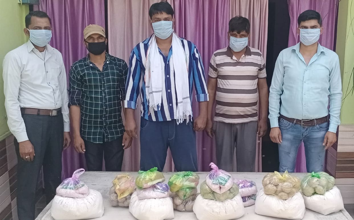 Hands extended for help, rationing 20 families