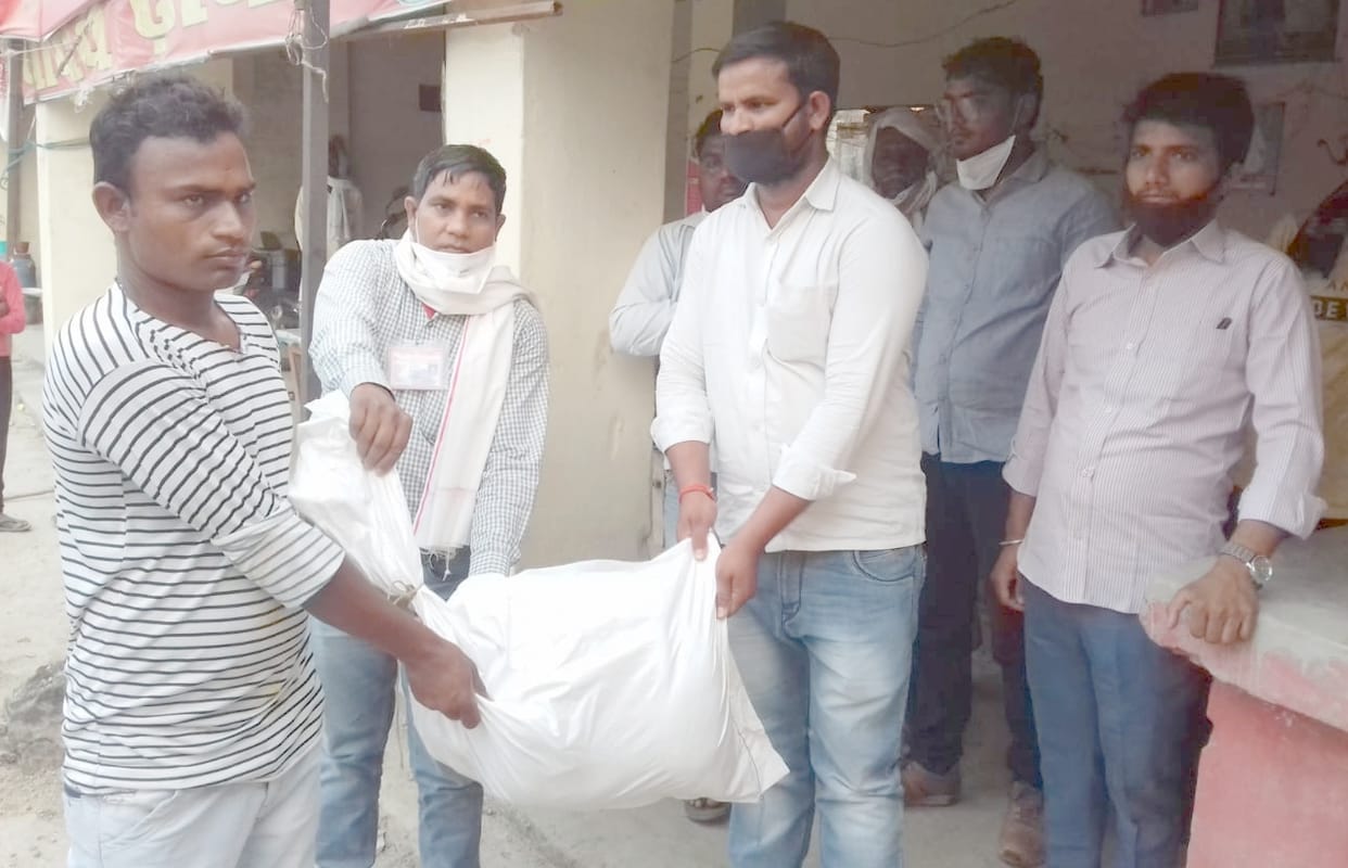 Organizations deliver ration and lunch packets to the poor