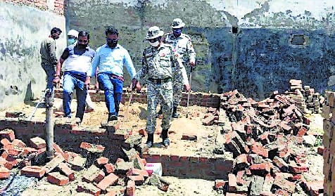 Construction being demolished by encroaching on the corporation's land