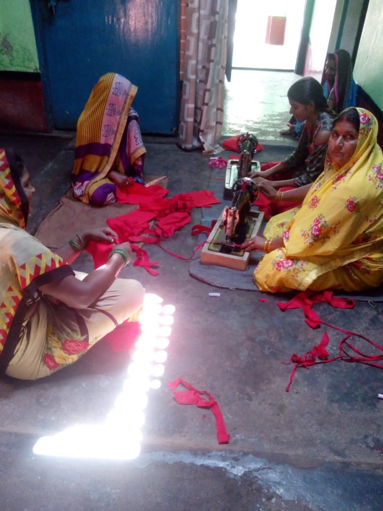 Group women engaged in making masks