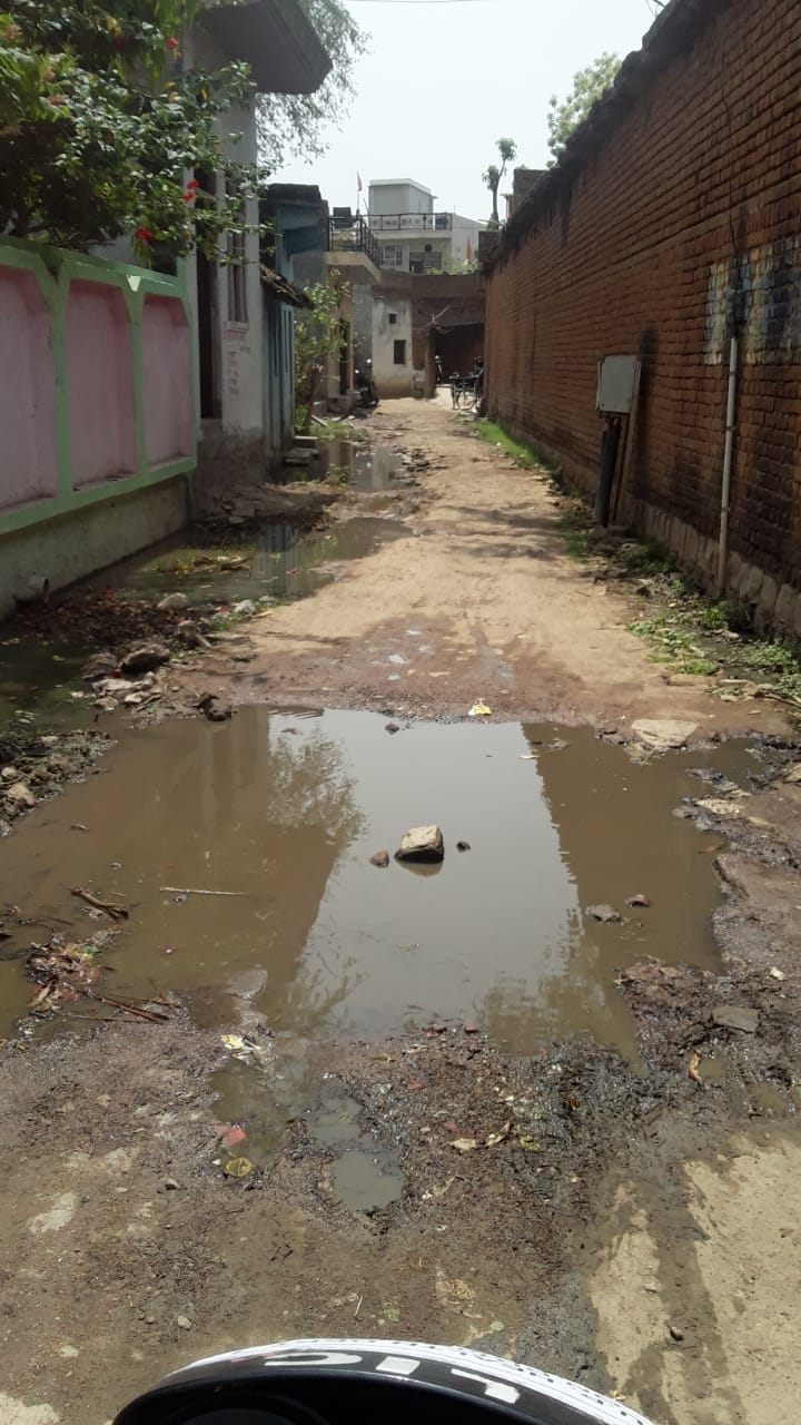 no drain, water flowing on road