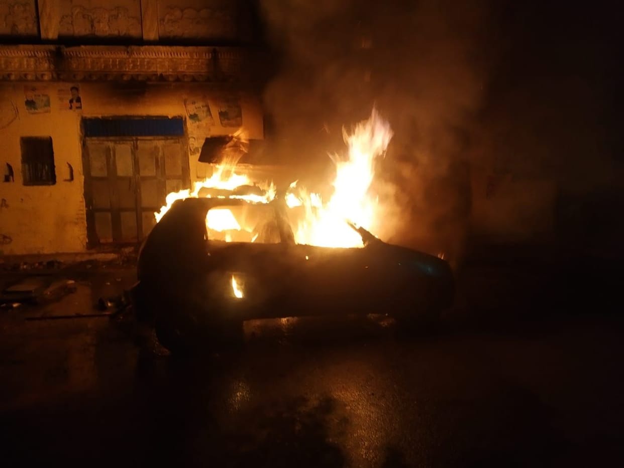 The fire in the car and three bikes in the curfew-hit area is raising questions about the security arrangements