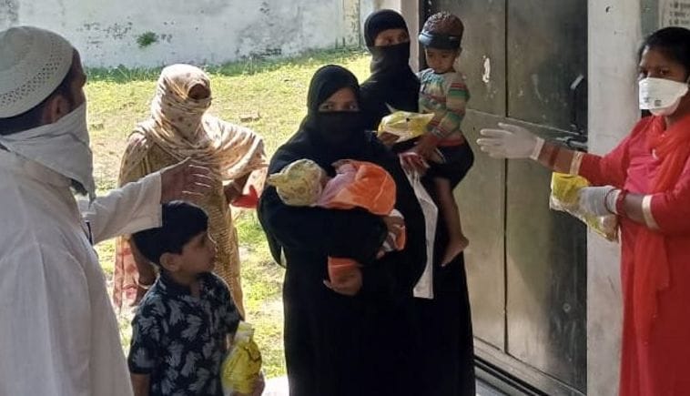 Project officer distributes nutrition in villages