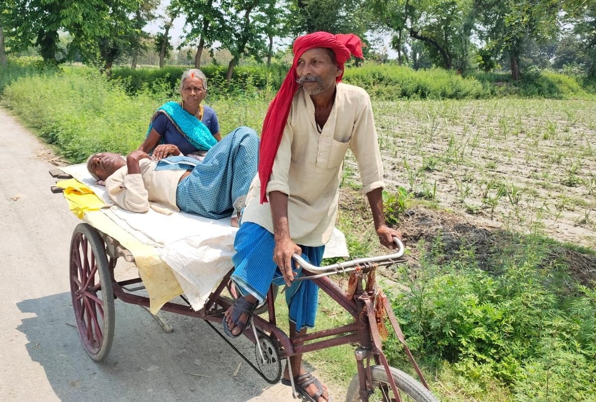 Woman arrives at bank to withdraw money with sick husband by Hand cart