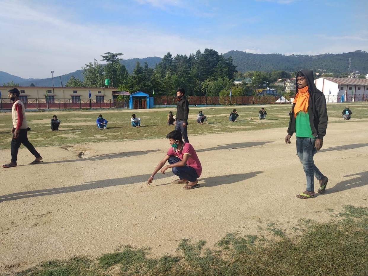 Spoon race between workers living in relief camp