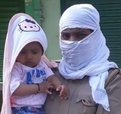Policeman doing duty with child