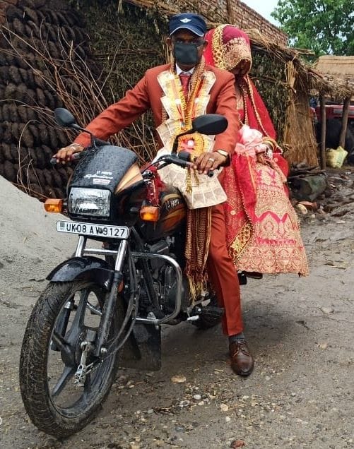 The bride left on the bike with a mask