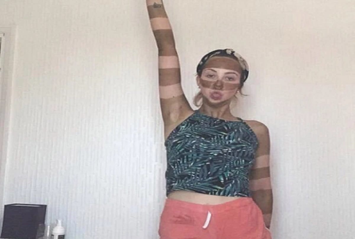 Bored woman gives herself a bizarre stripy fake tan makeover by using sellotape in lockdown