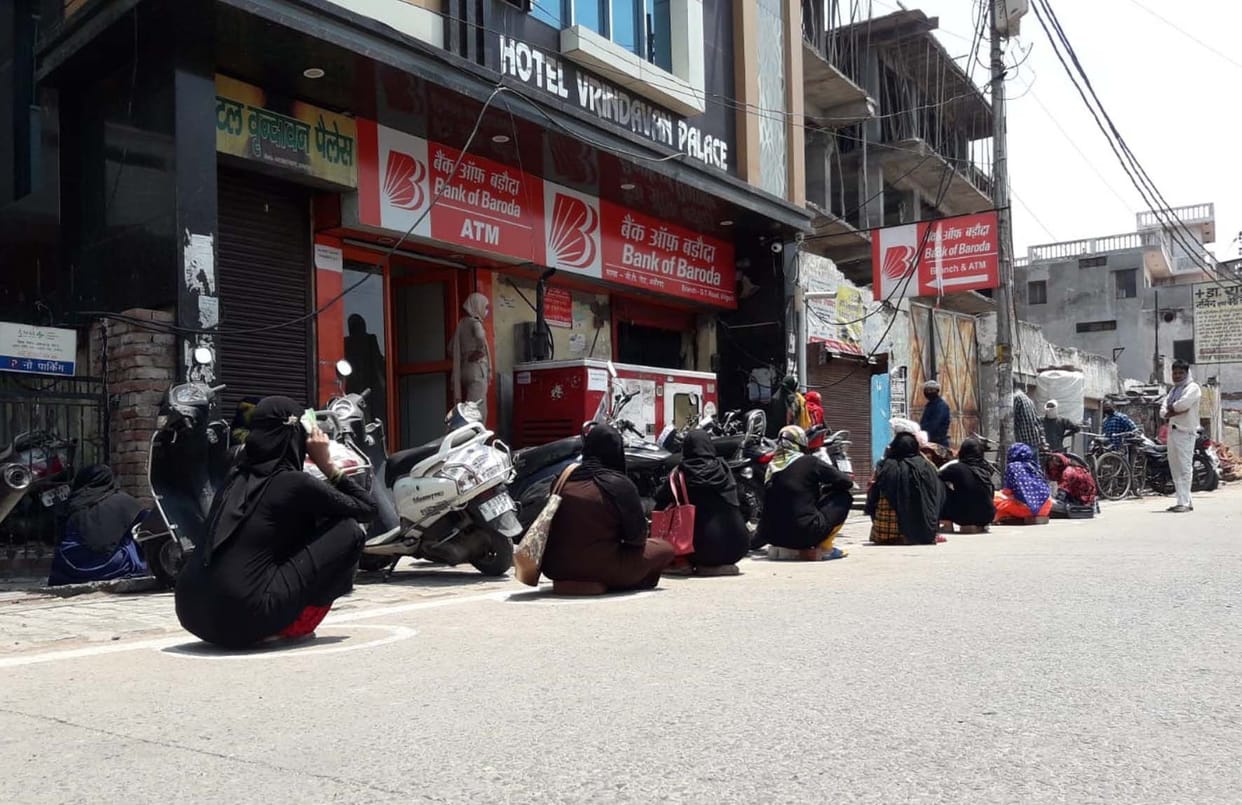 Line of women outside bank due unavailability of bank mitra facility.