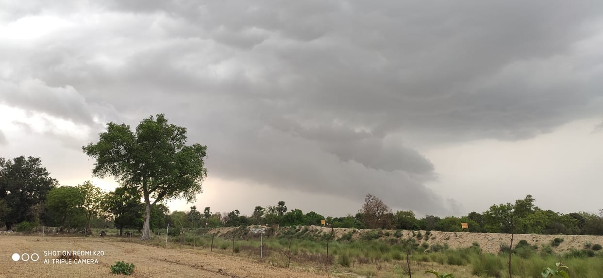 Spraying with strong storm, farmer worried