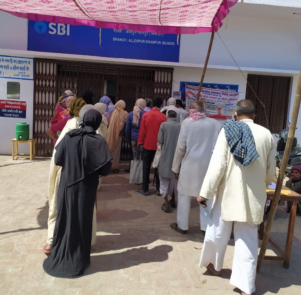 In spite of strict violation of social distancing outside banks