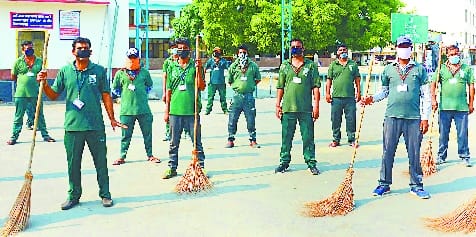 Scavengers sitting on strike at junction to protest pay cuts