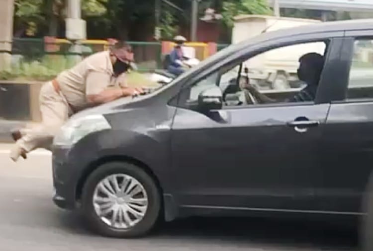 A car driver drags a police officer on car's bonnet in Jalandhar