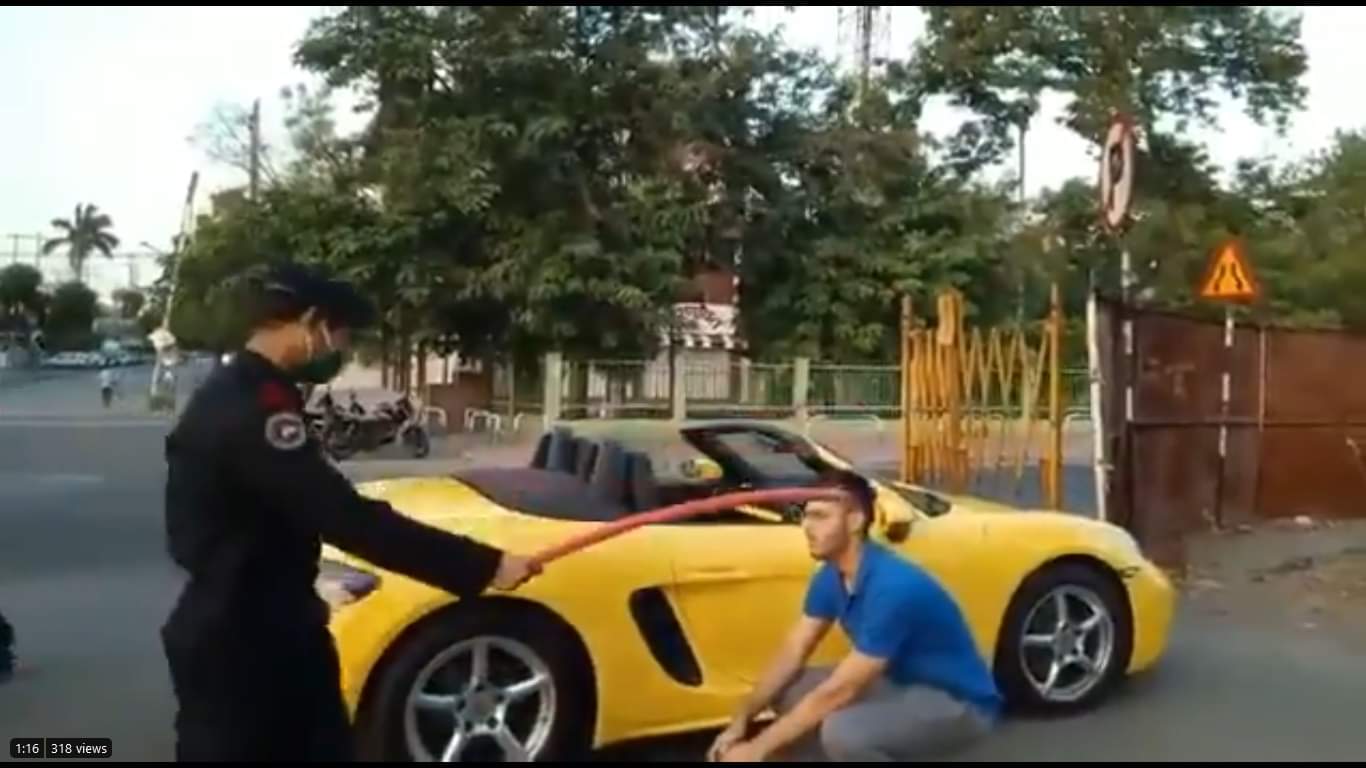 Porsche rider made to do sit ups for not wearing mask 