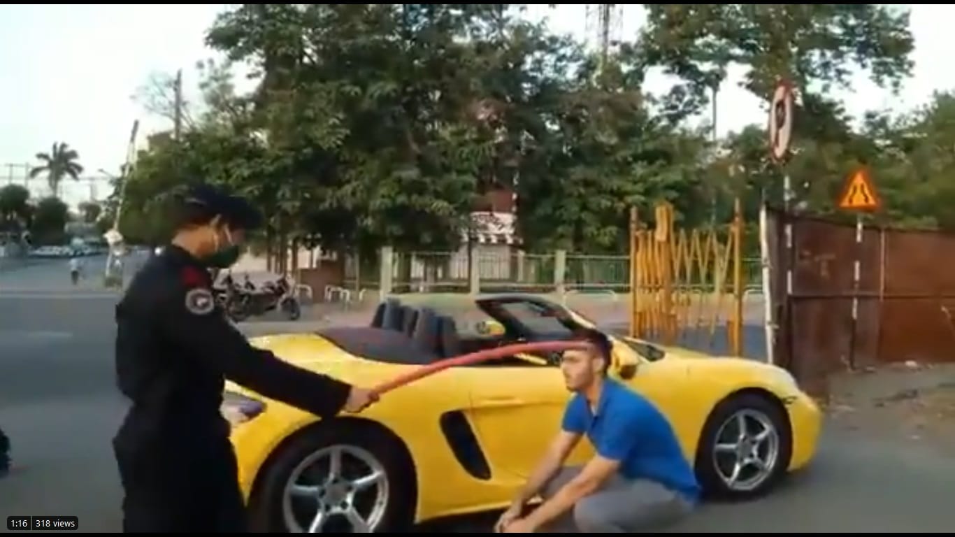 Porsche rider made to do sit ups for not wearing mask 