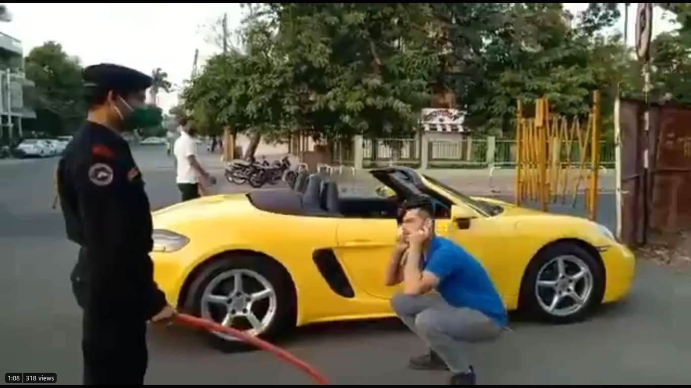 Porsche rider made to do sit ups for not wearing mask 