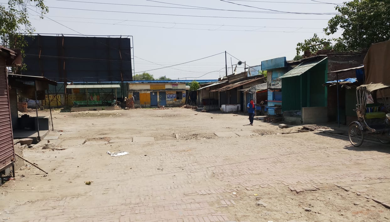 Bus stand deserted, put a lot of dirt