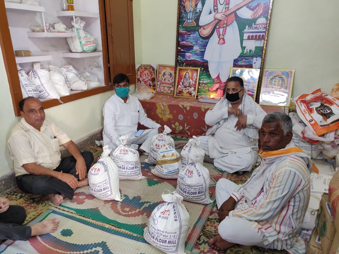 The Minister of State packed the ration kit and distributed it to the underprivileged