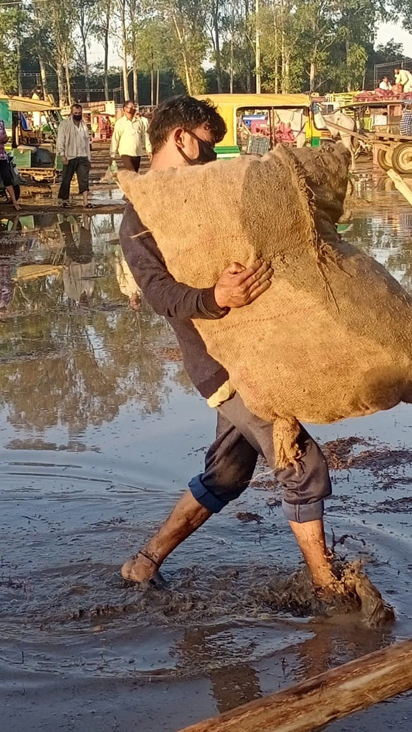 Water flooded in the temporary market due to rain, mud