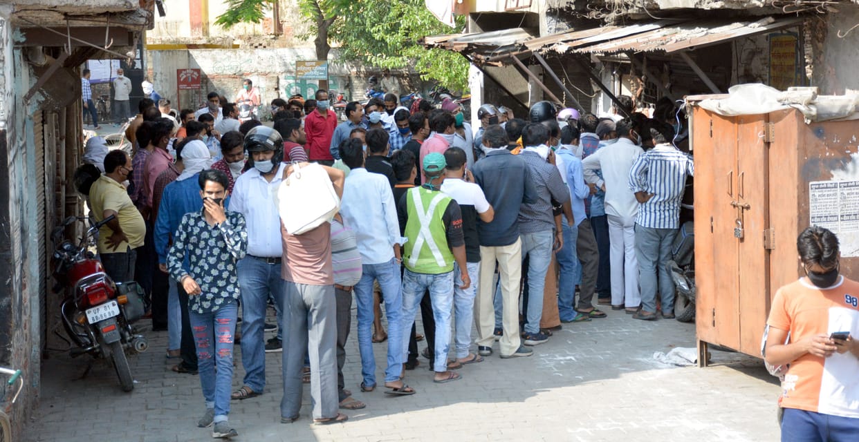 liquor shops open after 40 days in lockdown, social distancing taken for a ride