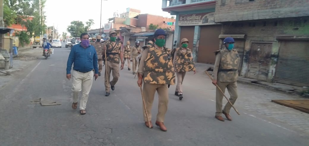 Policemen carry out flag march
